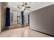 Bright bedroom with large window, exposed brick, and hardwood flooring at 434 Marietta Nw St # 301, Atlanta, GA 30313