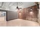 Open bedroom layout with exposed brick and neutral walls, providing a versatile space at 434 Marietta Nw St # 301, Atlanta, GA 30313