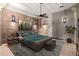 Chic bedroom with exposed brick walls, modern lighting, and a stylish bed with a grey rug at 434 Marietta Nw St # 301, Atlanta, GA 30313