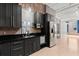 Modern kitchen featuring stainless steel appliances, black cabinets, and a stainless steel backsplash at 434 Marietta Nw St # 301, Atlanta, GA 30313