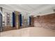 Bright living area features exposed brick, large windows, and concrete columns at 434 Marietta Nw St # 301, Atlanta, GA 30313