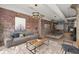 Comfortable open concept living area with exposed brick, modern decor and furnishings at 434 Marietta Nw St # 301, Atlanta, GA 30313