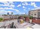 Enjoy city views from this rooftop deck, featuring comfortable seating, a bar, and stylish decor at 434 Marietta Nw St # 301, Atlanta, GA 30313