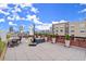 Expansive rooftop deck with outdoor seating, planters, and panoramic city skyline at 434 Marietta Nw St # 301, Atlanta, GA 30313