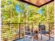 Relaxing balcony featuring an outdoor seating area with a beautiful view of the trees at 1250 Lupo Loop, Palmetto, GA 30268