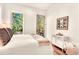 Bedroom featuring large windows with views of the trees at 1250 Lupo Loop, Palmetto, GA 30268