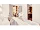 Bright and airy main bedroom featuring modern decor, wood floors, and double doors to an outdoor balcony at 1250 Lupo Loop, Palmetto, GA 30268