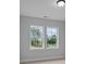 Bright bedroom featuring a great window view, neutral paint, and hardwood floors offers a calm atmosphere at 4830 Briscoe Dr, Cumming, GA 30028