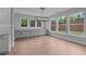 Dining Room features a large window, hardwood floors, and decorative lighting at 4830 Briscoe Dr, Cumming, GA 30028