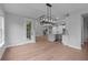Dining area with hardwood floors and sliding glass doors with access to a kitchen at 4830 Briscoe Dr, Cumming, GA 30028
