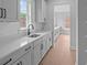 Bright kitchen featuring white cabinets, countertops, and subway tile backsplash, offering style and functionality at 4830 Briscoe Dr, Cumming, GA 30028
