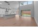 Sunlit open floor plan featuring a kitchen with an island, sliding doors, and an inviting indoor-outdoor flow at 4830 Briscoe Dr, Cumming, GA 30028
