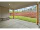 Covered patio overlooking professionally landscaped backyard at 4830 Briscoe Dr, Cumming, GA 30028