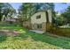 The backyard features a well-manicured lawn and a brick exterior at 4883 Rock Haven Dr, Lilburn, GA 30047
