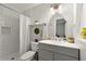 The bathroom features a standing shower, subway tile, and an ornate mirror above the sink at 4883 Rock Haven Dr, Lilburn, GA 30047