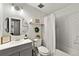 Clean bathroom features subway tile, updated vanity, and fixtures at 4883 Rock Haven Dr, Lilburn, GA 30047
