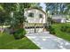 Charming home with a two-car garage, brick and siding accents, and a well-maintained front lawn at 4883 Rock Haven Dr, Lilburn, GA 30047