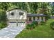 Charming home with a two-car garage, brick and siding accents, and landscaped front yard at 4883 Rock Haven Dr, Lilburn, GA 30047