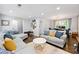 Spacious living room with hardwood floors, neutral walls, and comfortable seating at 4883 Rock Haven Dr, Lilburn, GA 30047
