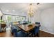 Open-concept with hardwood floors connecting the dining area and the living room at 4883 Rock Haven Dr, Lilburn, GA 30047