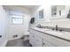 Updated bathroom with a double sink vanity, modern fixtures, and shower featuring subway tile at 3220 Toney Dr, Decatur, GA 30032