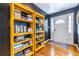 Charming entryway featuring hardwood floors, a rug, and colorful bookshelves at 3220 Toney Dr, Decatur, GA 30032