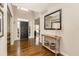 Elegant foyer with hardwood floors and a decorative console table with black accents at 3834 Upland Dr, Marietta, GA 30066