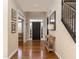 Inviting foyer with hardwood floors, black door, stairs and a stylish console table at 3834 Upland Dr, Marietta, GA 30066