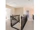 Upstairs hallway has neutral carpet, black handrails and white trim at 3834 Upland Dr, Marietta, GA 30066