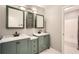 Spa-like bathroom with dual vanities, marble countertops, and modern fixtures at 6520 Roswell Rd # 79, Sandy Springs, GA 30328