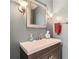 Charming powder room features a modern vanity, stylish mirror, and updated fixtures at 6520 Roswell Rd # 79, Sandy Springs, GA 30328