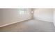 Well-lit bedroom with plush carpeting and a large window offering plenty of natural light at 6520 Roswell Rd # 79, Sandy Springs, GA 30328