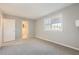 Inviting bedroom with plush carpeting, a sunny window, and ample space at 6520 Roswell Rd # 79, Sandy Springs, GA 30328