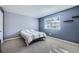 Comfortable bedroom with neutral carpet, and light-blue walls and space for a full bed at 6520 Roswell Rd # 79, Sandy Springs, GA 30328