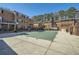 Large community pool covered for the off-season, surrounded by paving and residential buildings at 6520 Roswell Rd # 79, Sandy Springs, GA 30328
