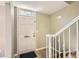 Entryway featuring a white front door and staircase at 6520 Roswell Rd # 79, Sandy Springs, GA 30328