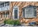 Charming brick townhouse with decorative door frame and bay window at 6520 Roswell Rd # 79, Sandy Springs, GA 30328