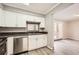 Bright kitchen featuring stainless steel appliances, white cabinetry and an eye-catching backsplash at 6520 Roswell Rd # 79, Sandy Springs, GA 30328