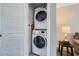 Convenient laundry area features a stacked washer and dryer, maximizing space in a compact design at 6520 Roswell Rd # 79, Sandy Springs, GA 30328