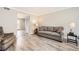 Comfortable living room with a gray sofa and wood floors at 6520 Roswell Rd # 79, Sandy Springs, GA 30328
