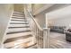 Staircase with white railing leading to the upper level, adjacent to the living area at 6520 Roswell Rd # 79, Sandy Springs, GA 30328