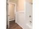 Clean and updated bathroom features a white tiled shower over tub at 1945 Dodson Sw Dr, Atlanta, GA 30311