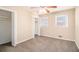 Cozy bedroom with neutral carpet, closet, and bright windows at 1945 Dodson Sw Dr, Atlanta, GA 30311