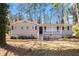 Charming brick home with a covered front porch and manicured lawn and mature trees at 1945 Dodson Sw Dr, Atlanta, GA 30311