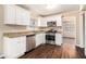 Updated kitchen with white cabinets, stainless steel appliances, and granite countertops at 1945 Dodson Sw Dr, Atlanta, GA 30311