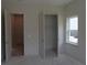 A bedroom features natural light from a window and an open closet at 4780 Briscoe Dr, Cumming, GA 30028