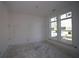 An unfinished bedroom features natural light from a double window at 4780 Briscoe Dr, Cumming, GA 30028