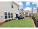 A spacious backyard features a patio with an outdoor seating area and a grill at 222 Ellis Ln, Woodstock, GA 30189