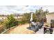 Backyard patio featuring outdoor furniture, a grill, and a fenced perimeter at 222 Ellis Ln, Woodstock, GA 30189