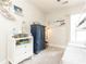 ' bedroom with white bunk bed, blue dresser, white storage unit, and a window offering natural light at 222 Ellis Ln, Woodstock, GA 30189